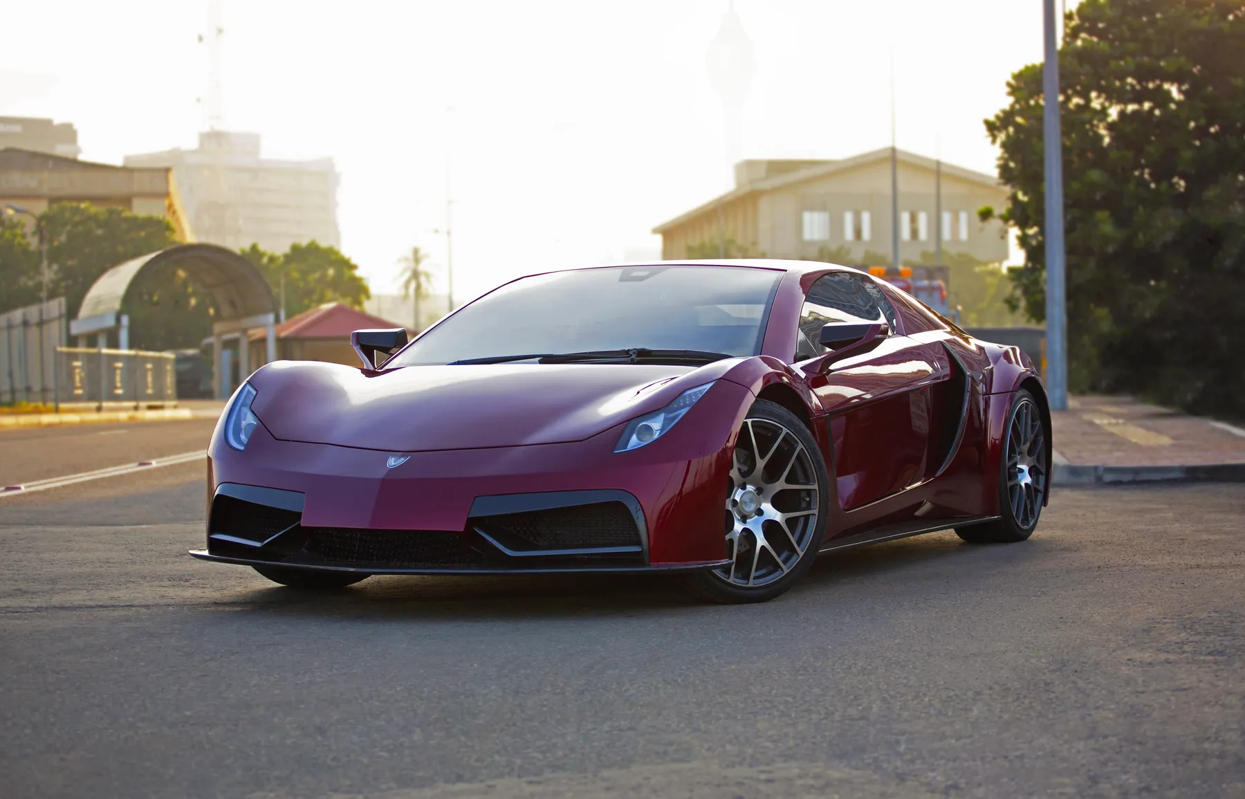 The VEGA on a street in Colombo, with the Lotus Tower behind it