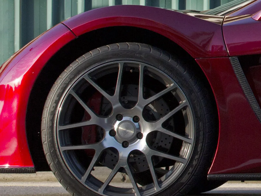 Front wheel of the VEGA with its red brake caliper